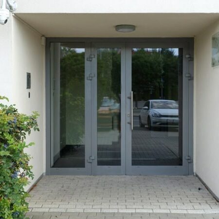 Entrance to a store or office. Gray entrance or office doors